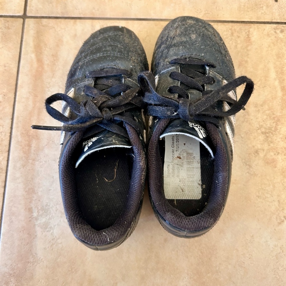 Well used Adias toddler soccer cleats